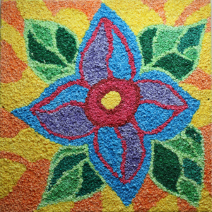 Photo of colorful flower made of small pieces of rolled up colored tissue paper that creates a flower.